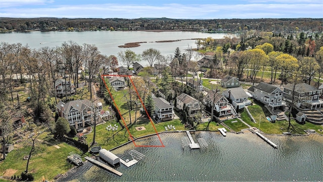 birds eye view of property featuring a residential view and a water view