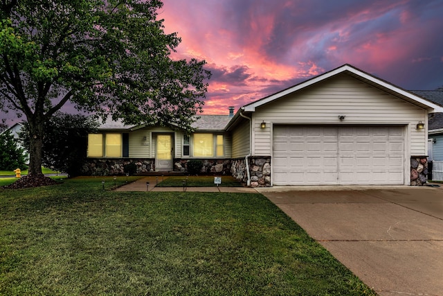 ranch-style home with stone siding, concrete driveway, a garage, a shingled roof, and a front yard