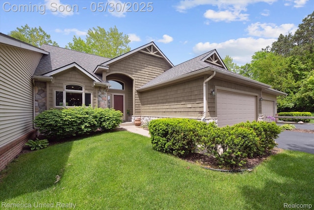 1317 Peppergrove Dr, Brighton, MI 48116 - ranch-style home featuring a garage, stone siding, a front yard, and a shingled roof