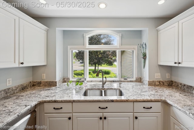 1317 Peppergrove Dr, Brighton, MI 48116 - kitchen with a sink, white cabinets, healthy amount of natural light, recessed lighting, and light stone counters