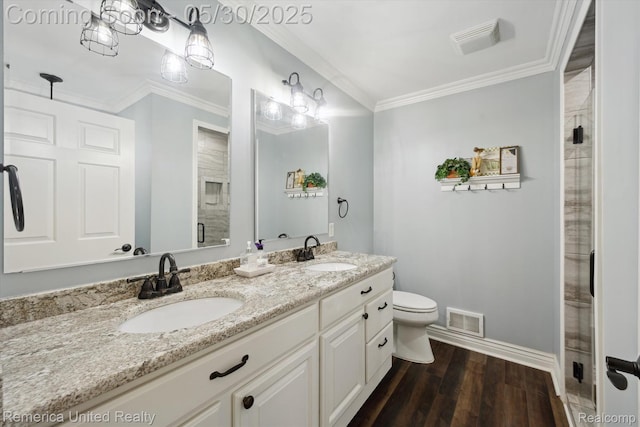 1317 Peppergrove Dr, Brighton, MI 48116 - bathroom with double vanity, baseboards, toilet, wood finished floors, and crown molding