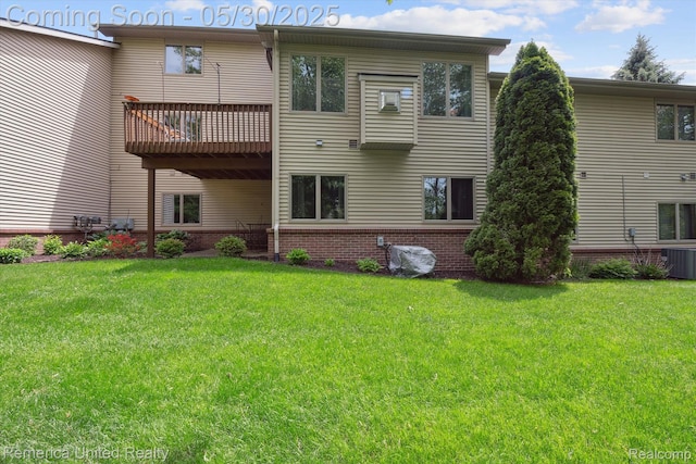 1317 Peppergrove Dr, Brighton, MI 48116 - rear view of house with central AC, a lawn, brick siding, and a deck