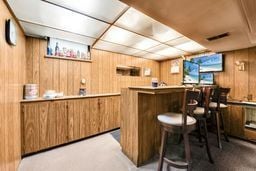 bar with wood walls and a dry bar