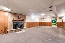 interior space featuring wooden walls and wainscoting