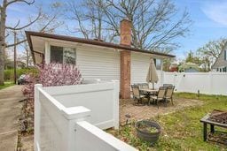 exterior space with fence and a chimney