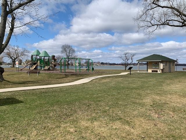 communal playground featuring a lawn