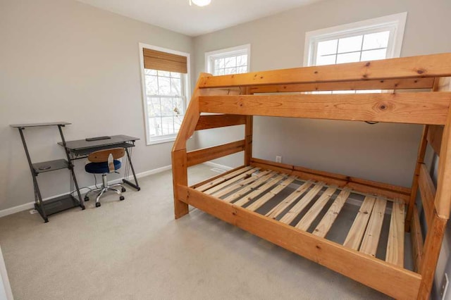 bedroom featuring baseboards and carpet flooring