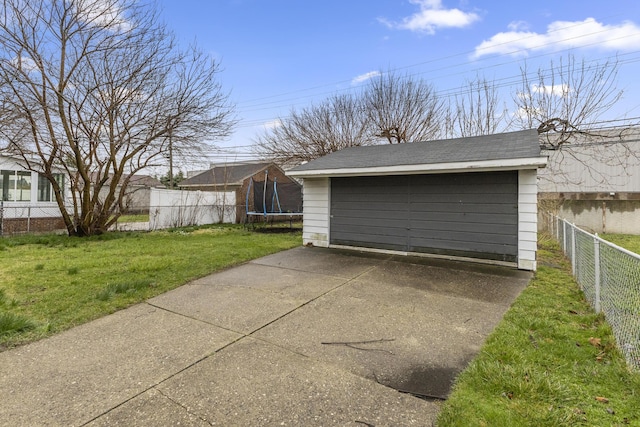 8450 Warren Blvd, Center Line, MI 48015 - garage featuring fence and a trampoline