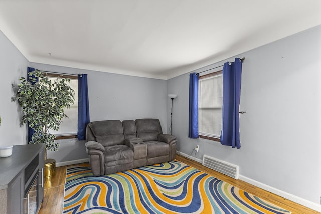 8450 Warren Blvd, Center Line, MI 48015 - living area featuring baseboards, wood finished floors, and visible vents