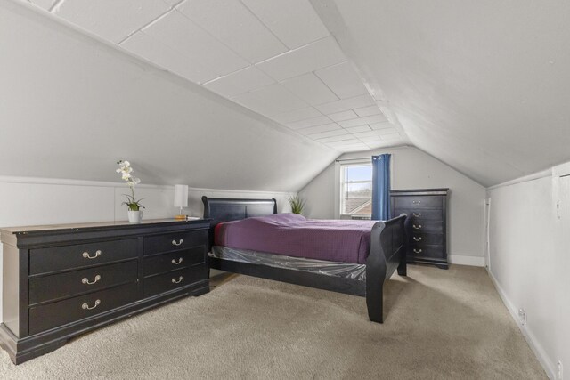 8450 Warren Blvd, Center Line, MI 48015 - bedroom with lofted ceiling, baseboards, and carpet
