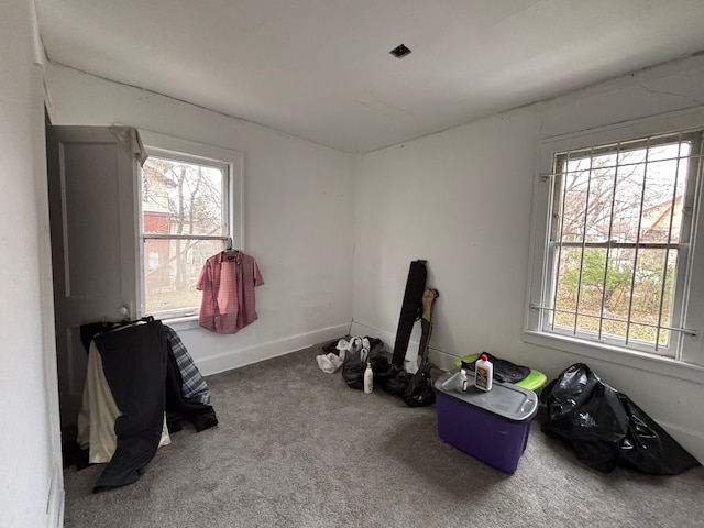game room featuring carpet floors and baseboards
