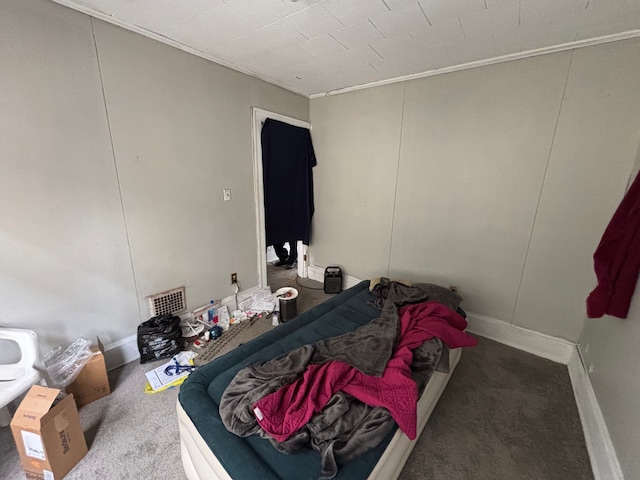 bedroom featuring carpet floors and visible vents