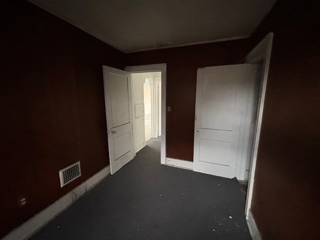 unfurnished bedroom featuring baseboards and visible vents