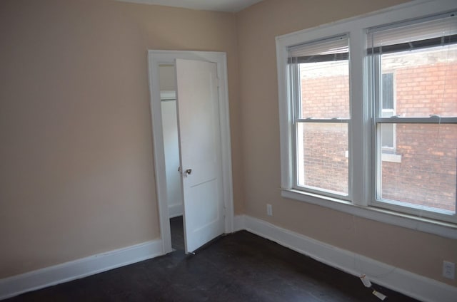 empty room with baseboards