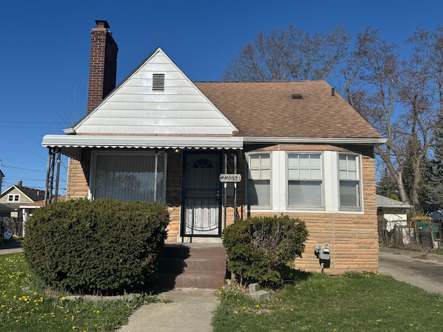 22051 Firwood Ave, Eastpointe, MI 48021 - bungalow-style home with a chimney and roof with shingles