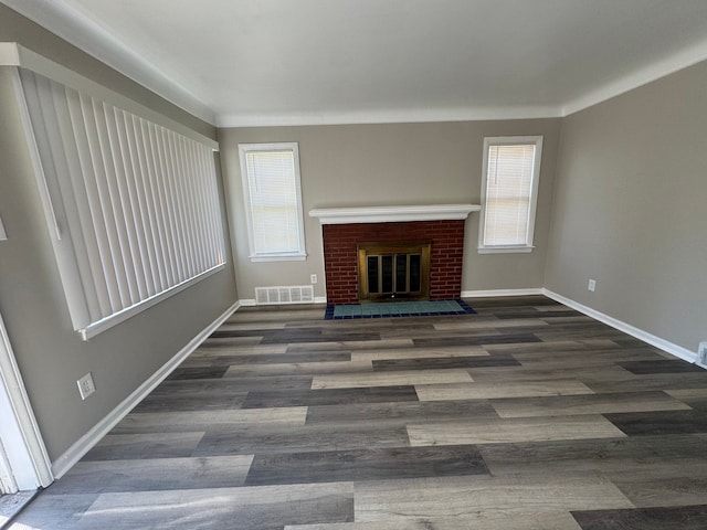 22051 Firwood Ave, Eastpointe, MI 48021 - unfurnished living room featuring baseboards, a healthy amount of sunlight, wood finished floors, and visible vents