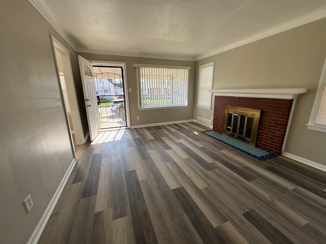 22051 Firwood Ave, Eastpointe, MI 48021 - unfurnished living room with wood finished floors, baseboards, a brick fireplace, and visible vents