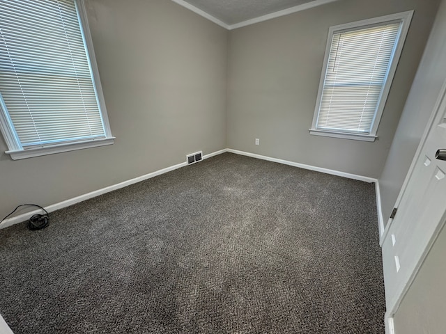 22051 Firwood Ave, Eastpointe, MI 48021 - empty room featuring dark colored carpet, visible vents, crown molding, and baseboards