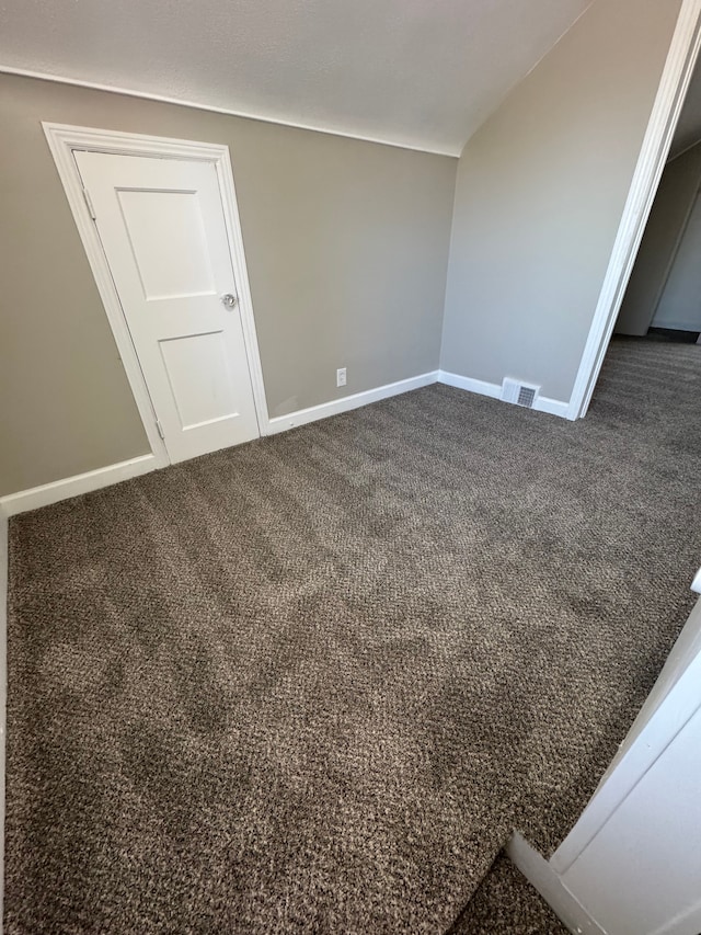 22051 Firwood Ave, Eastpointe, MI 48021 - empty room with baseboards, dark colored carpet, and visible vents