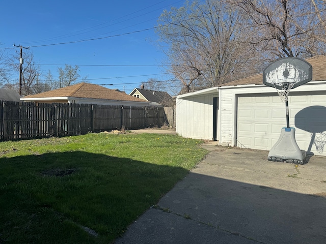 22051 Firwood Ave, Eastpointe, MI 48021 - view of yard featuring fence, an outbuilding, and a garage