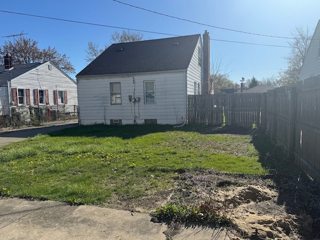 22051 Firwood Ave, Eastpointe, MI 48021 - view of front facade featuring a fenced backyard, roof with shingles, and a front yard