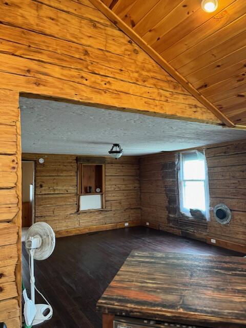 314 W Main, Whitehall, MI 49461 - interior space with lofted ceiling, wooden walls, and hardwood / wood-style flooring