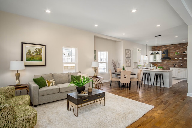 living room with recessed lighting and wood finished floors