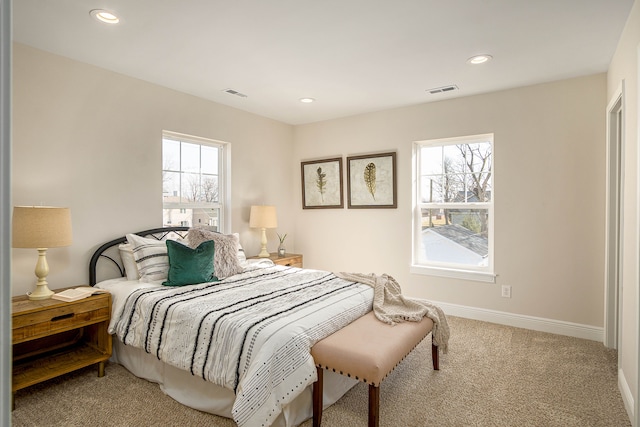 carpeted bedroom with recessed lighting and baseboards