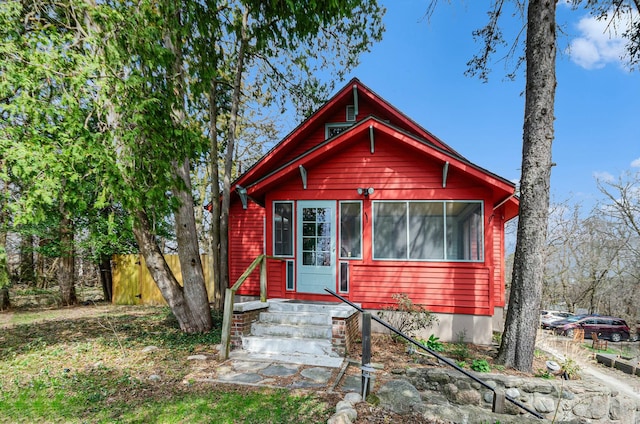 view of front of house with fence