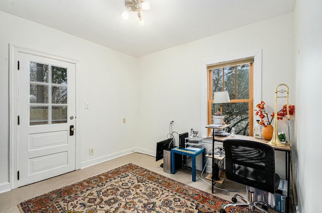 office with carpet floors and baseboards