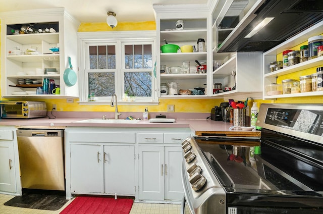 kitchen with a toaster, appliances with stainless steel finishes, open shelves, and a sink