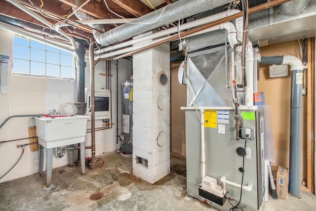 utilities with heating unit, a sink, and gas water heater