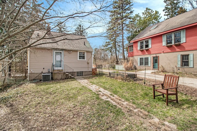view of yard with fence and cooling unit