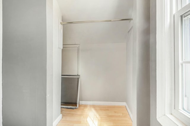 spacious closet with wood finished floors