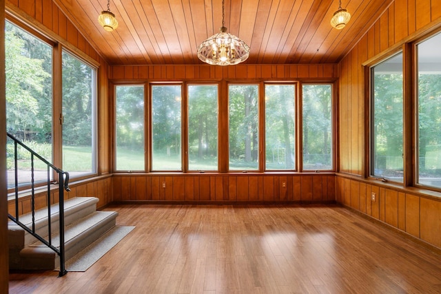 3091 Warwick Rd, Ann Arbor, MI 48104 - unfurnished sunroom with wood ceiling, wooden walls, a wealth of natural light, and wood-type flooring
