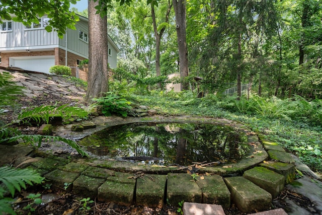 3091 Warwick Rd, Ann Arbor, MI 48104 - view of yard with an attached garage