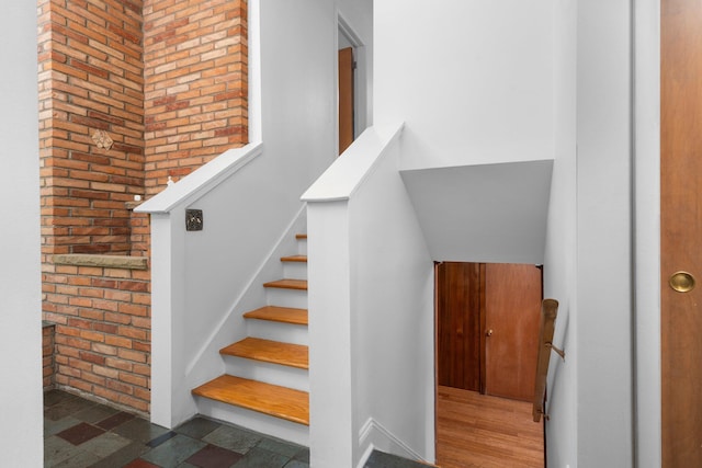3091 Warwick Rd, Ann Arbor, MI 48104 - stairs with brick wall
