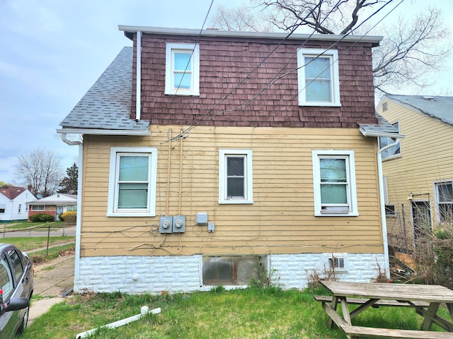 20117 Santa Rosa Dr, Detroit, MI 48221 - view of side of home featuring fence and a shingled roof