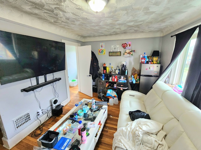 20117 Santa Rosa Dr, Detroit, MI 48221 - bedroom featuring freestanding refrigerator and wood finished floors
