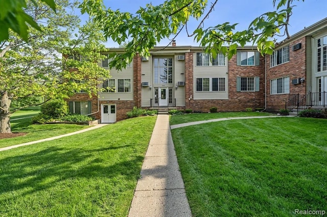 500 Romeo Rd Unit 116, Rochester, MI 48307 - townhome / multi-family property with brick siding and a front yard