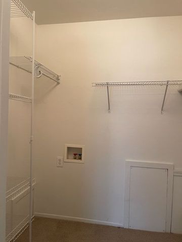 500 Romeo Rd Unit 116, Rochester, MI 48307 - clothes washing area with baseboards, laundry area, and washer hookup