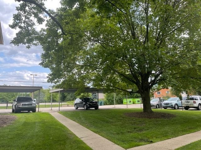 500 Romeo Rd Unit 116, Rochester, MI 48307 - view of home's community featuring a yard and a detached carport