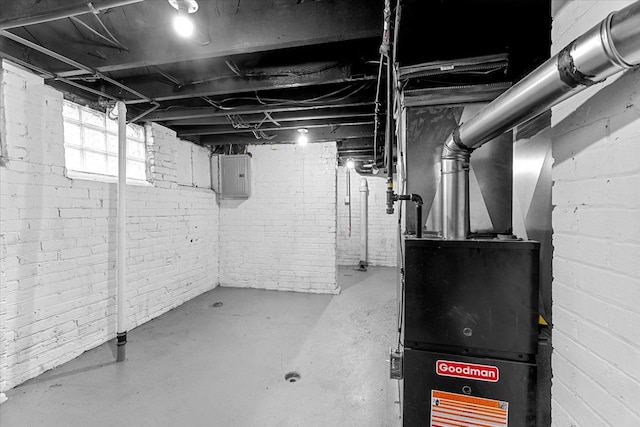 below grade area with brick wall and electric panel