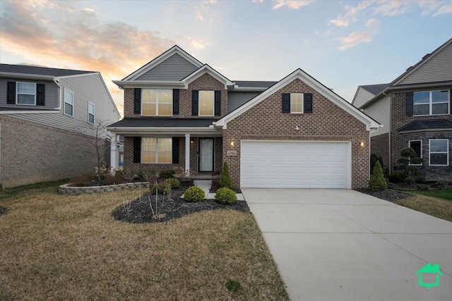 traditional-style home with concrete driveway, brick siding, a lawn, and covered porch