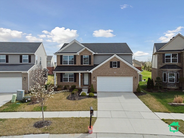 view of front facade featuring a front lawn, driveway, a porch, brick siding, and an attached garage