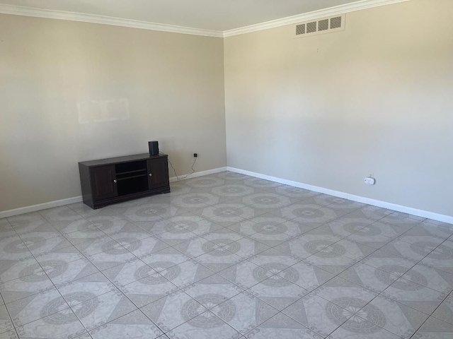 unfurnished room with baseboards, ornamental molding, and visible vents