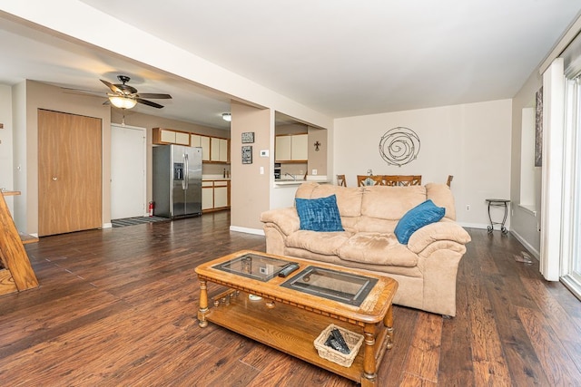6472 Lochaven Ln, Waterford, MI 48327 - living room with ceiling fan, dark wood-style flooring, and baseboards