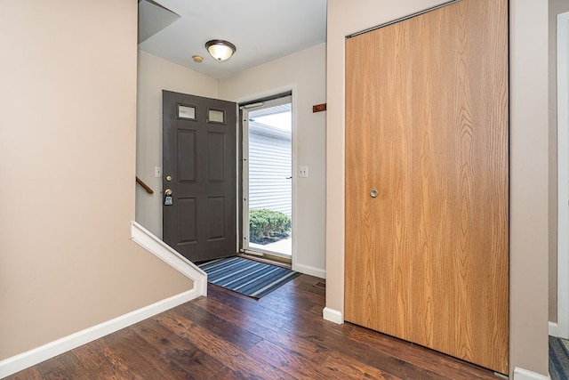 6472 Lochaven Ln, Waterford, MI 48327 - entryway with baseboards and dark wood-type flooring