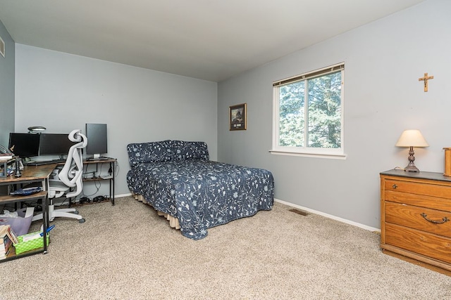 6472 Lochaven Ln, Waterford, MI 48327 - carpeted bedroom with an office area and baseboards