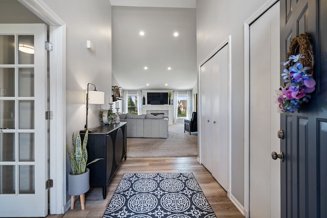 hall with recessed lighting and light wood-style floors